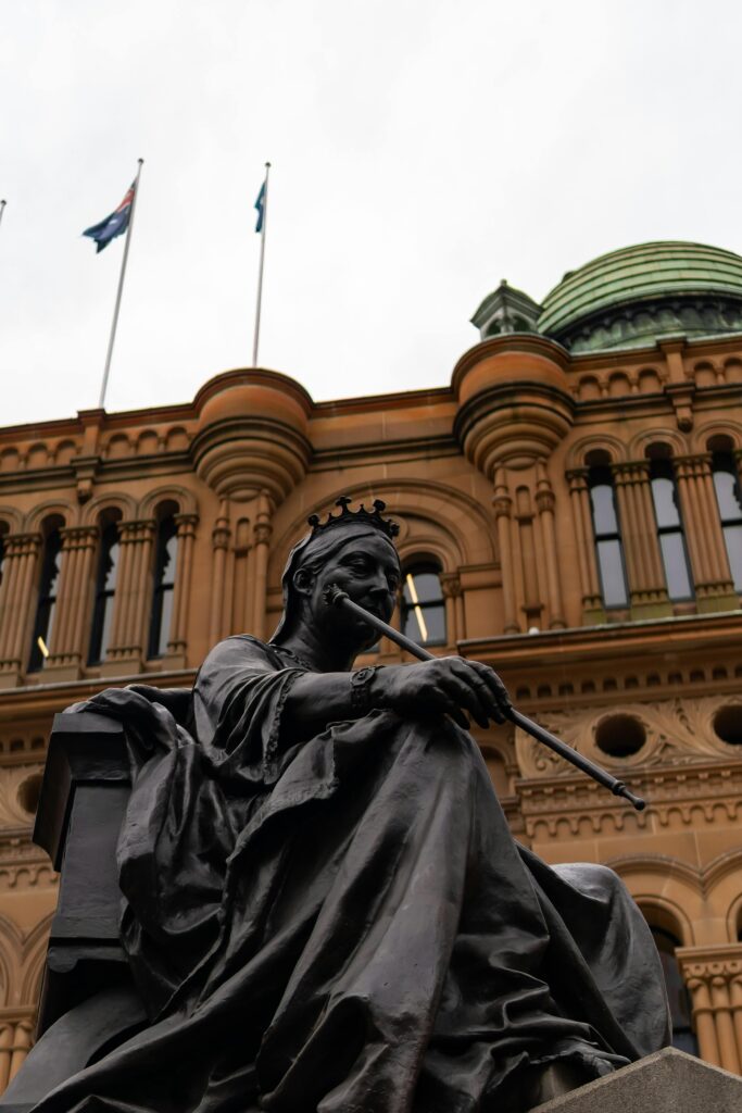 Statue at Queen Victoria Building in Sydney, depicting historical architecture and art.
